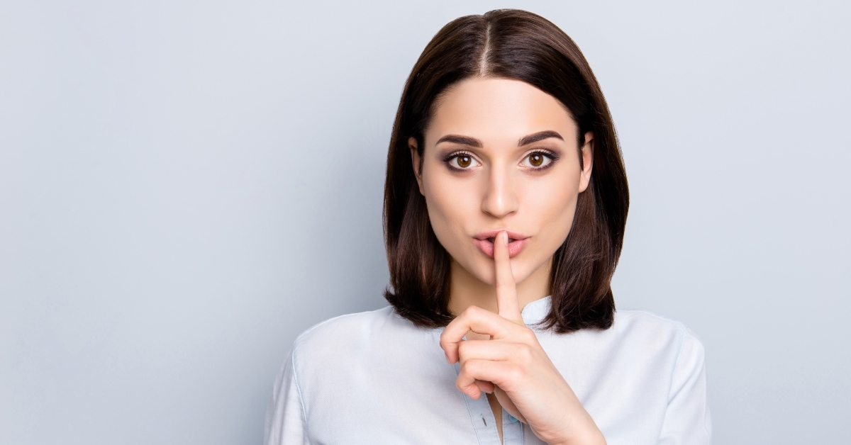 woman making hush gesture