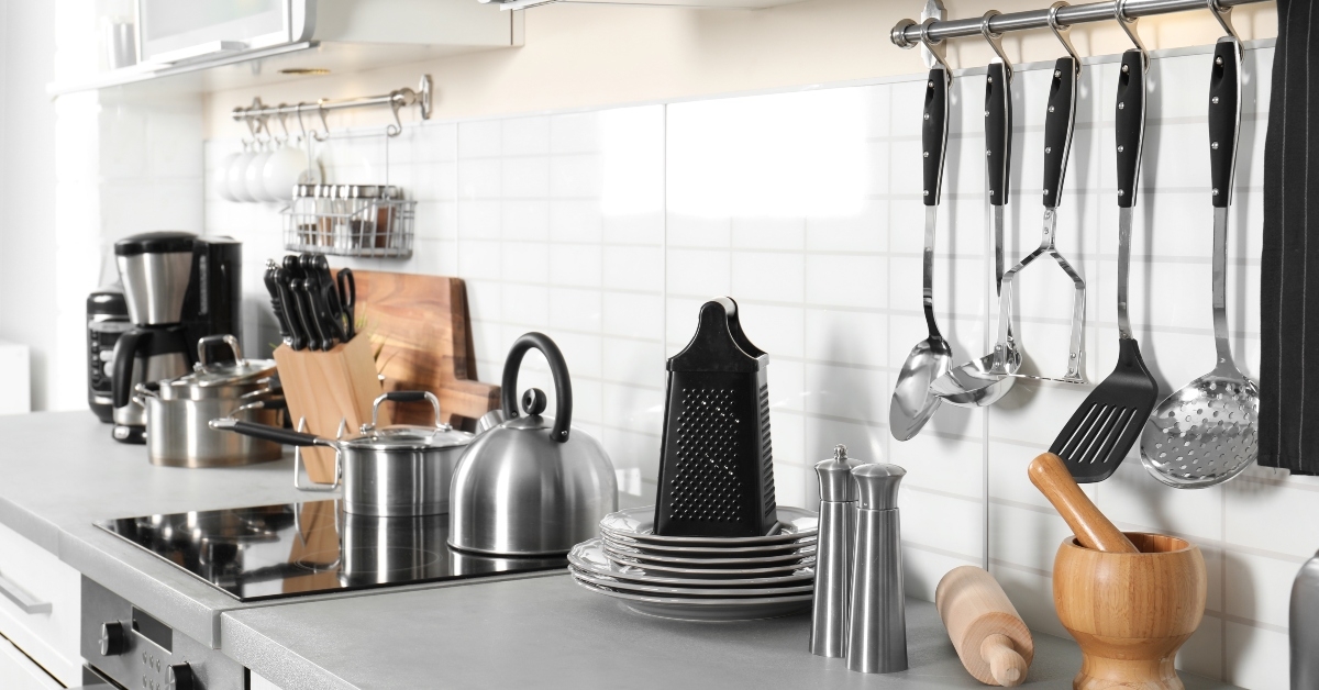 appliances clean dishes and utensils on kitchen counter