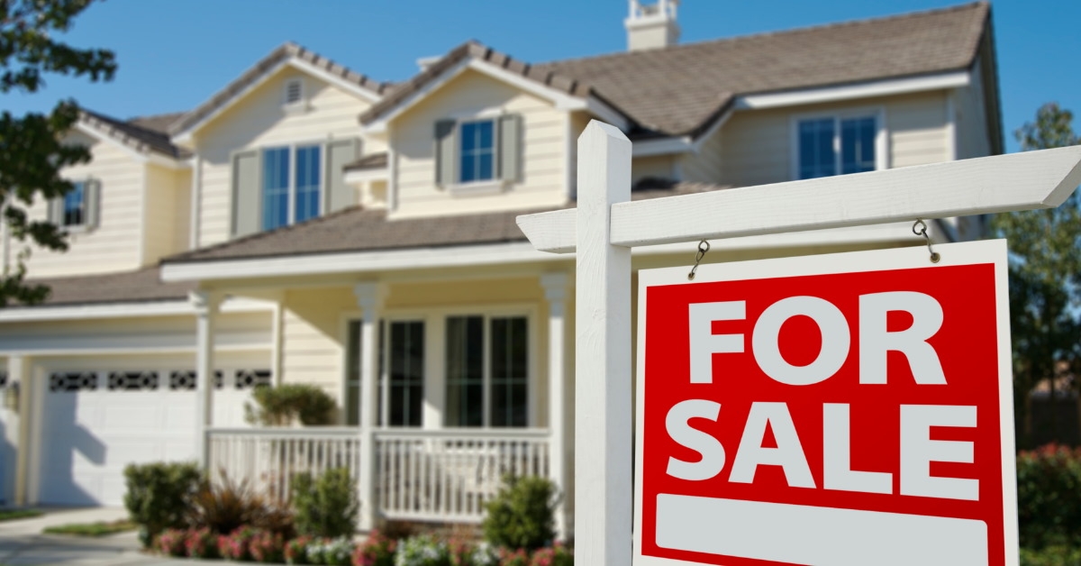 beautiful house with for sale sign