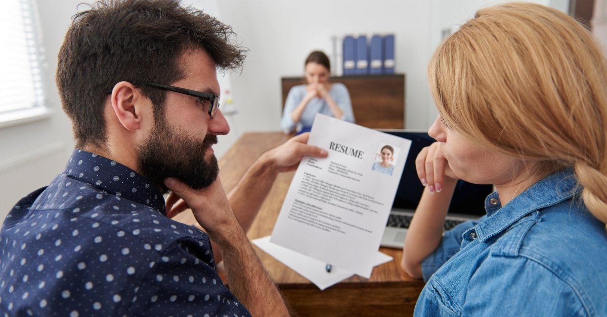 managers looking at job applicant's resume