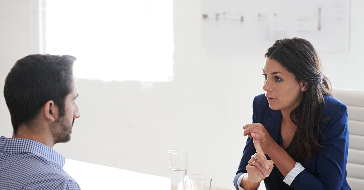 business woman having a discussion with male colleague