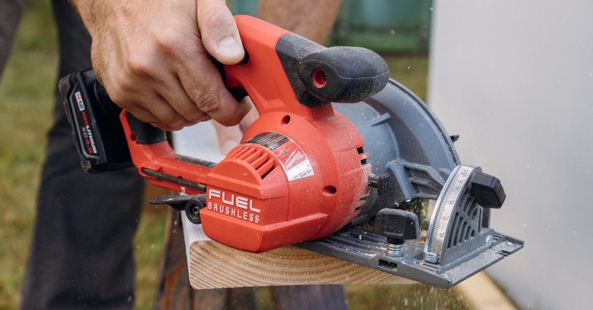 carpenter cutting wooden plank