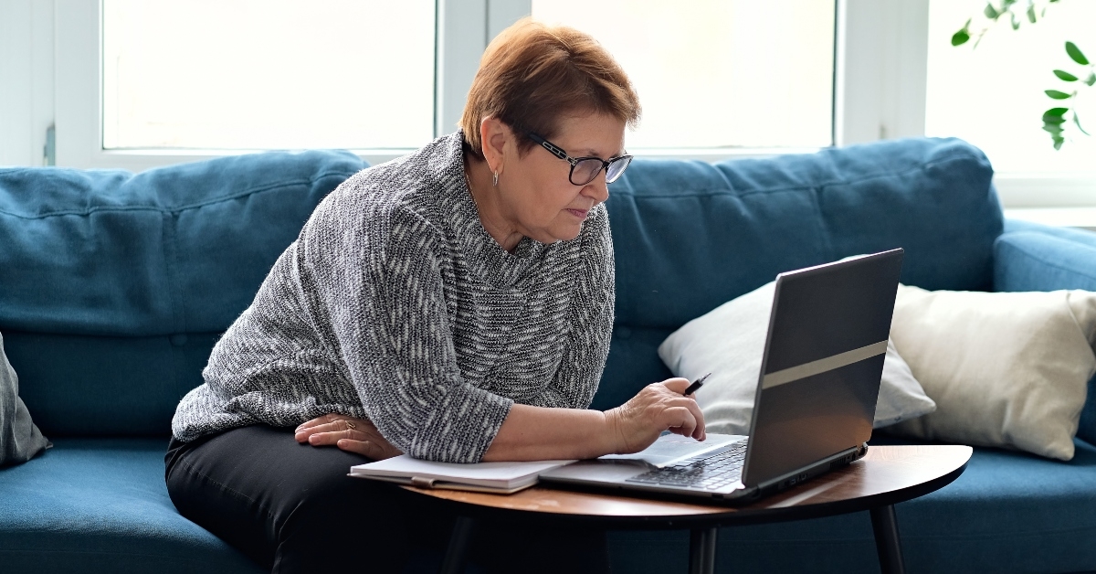 senior woman using laptop for websurfing
