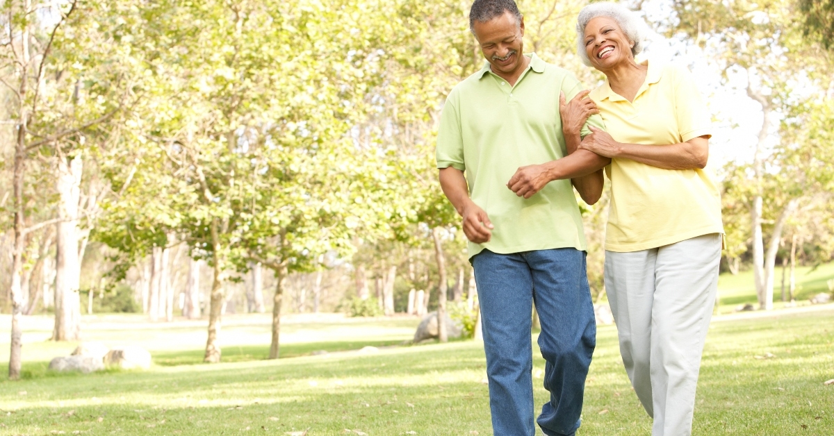 senior couple walking in the park