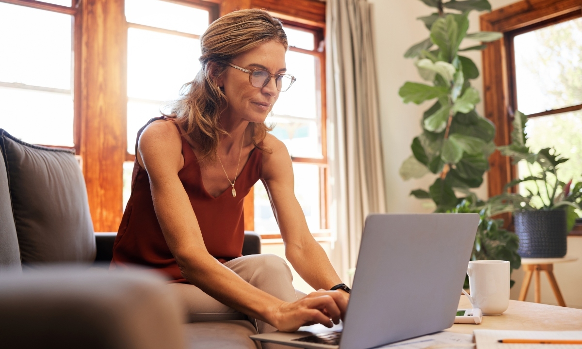 senior woman on laptop for finance planning