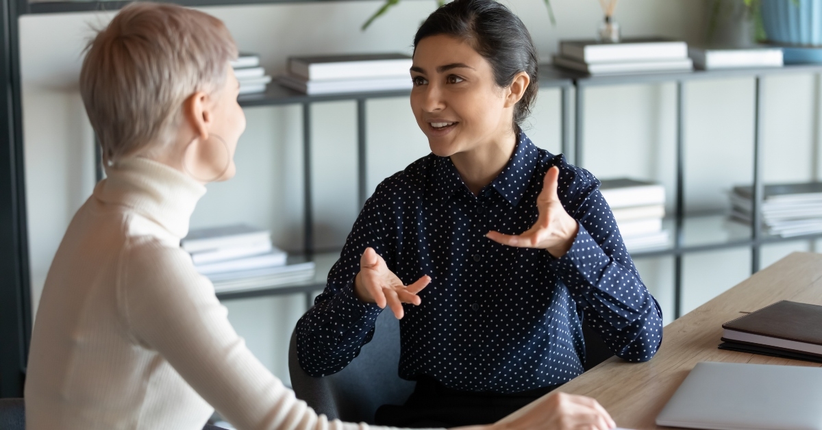 female employee talking with an office mate