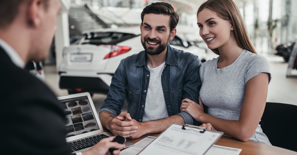couple at car dealership