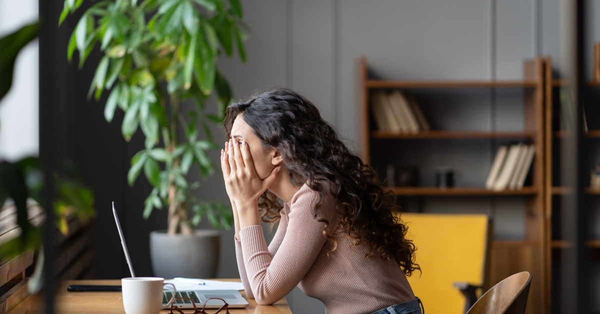 office worker struggling through task