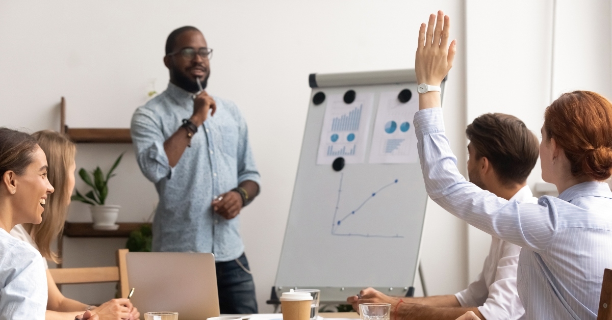 employee interrupts male mentor giving presentation