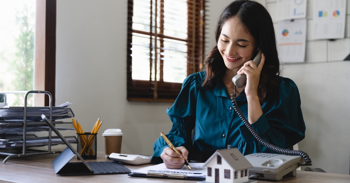 Real estate agent professional making business call