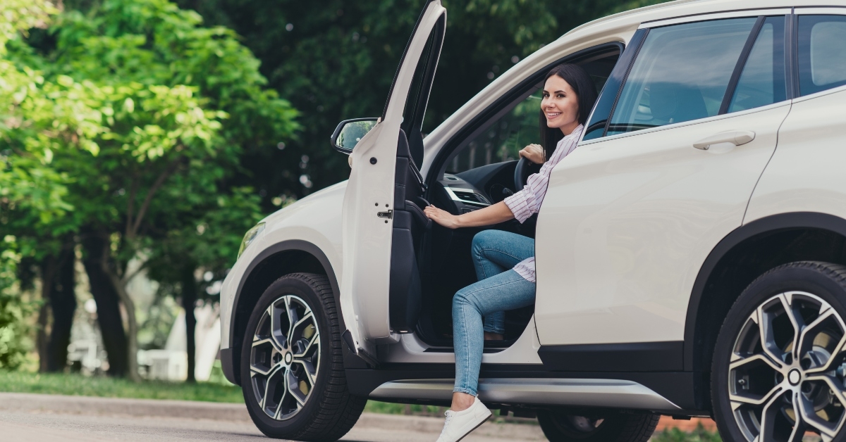 female driver opens car door