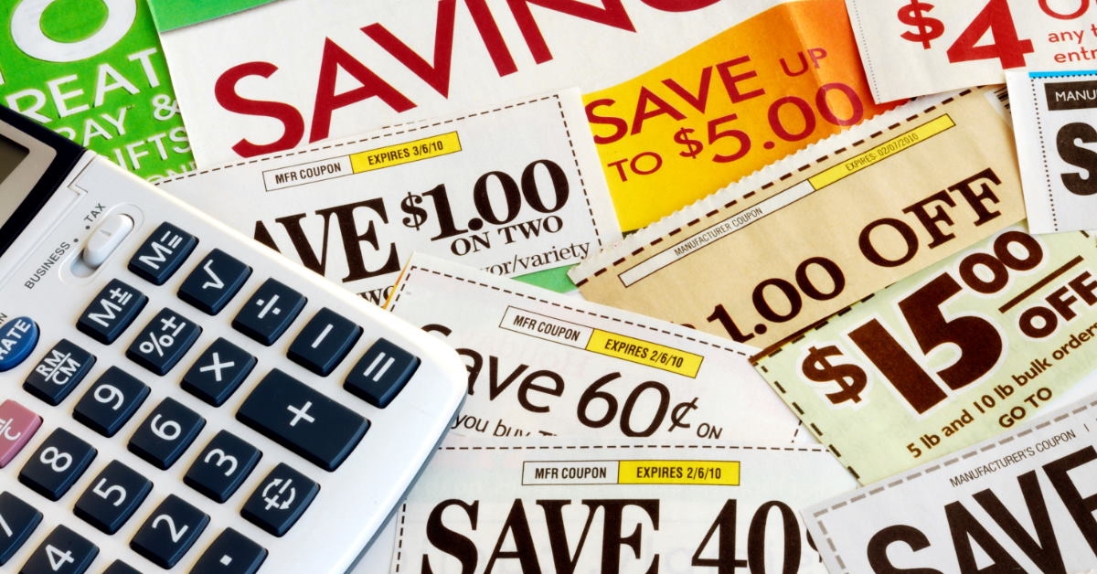 bunch of discount coupons all over the table 