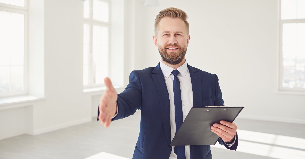 male real estate agent with handshake