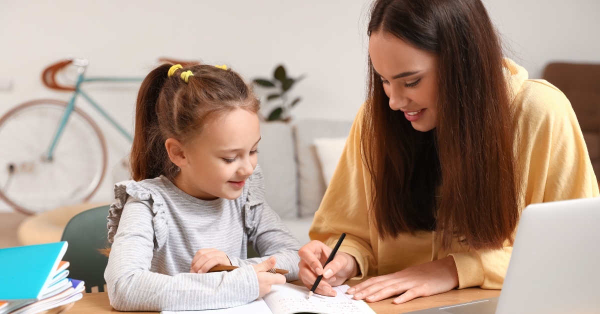 girl studying with tutor at home