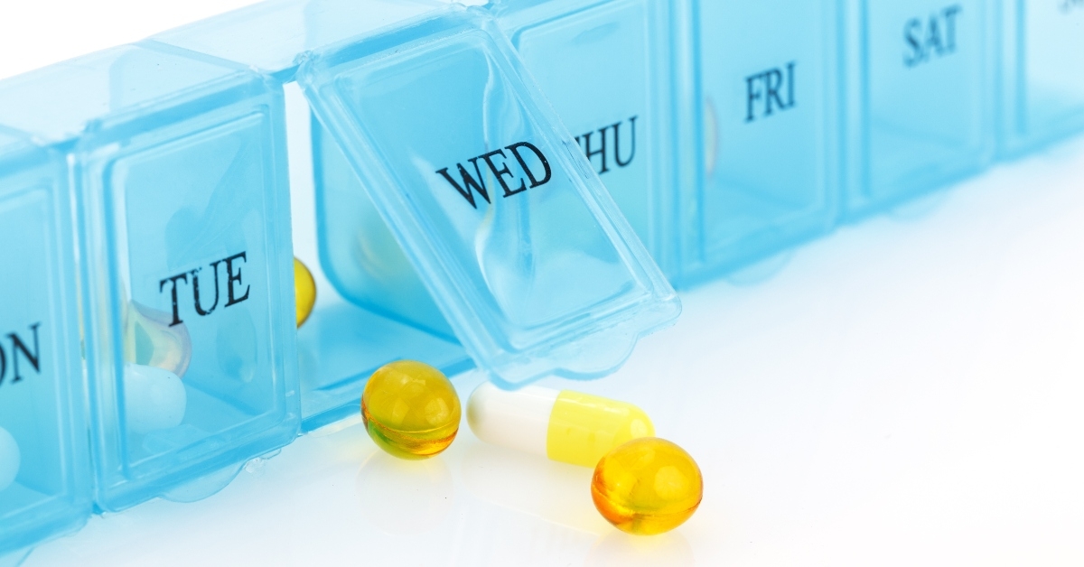pill organizer with variety of pills and supplement