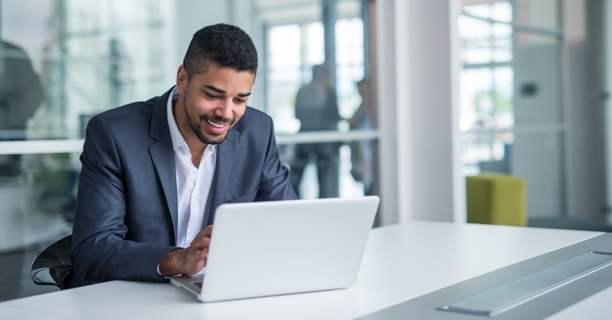 businessman in suit working on laptop