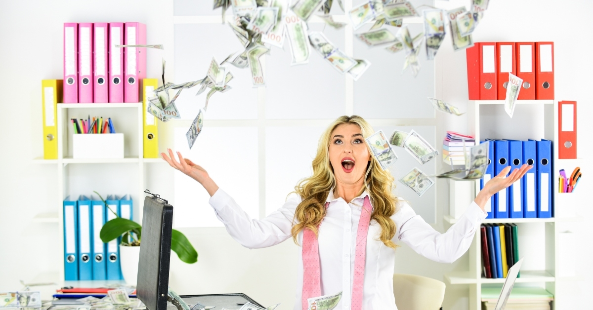 woman enjoys money falling from above