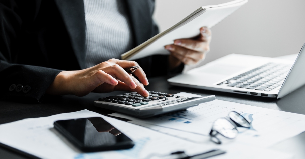 accountant using calculator
