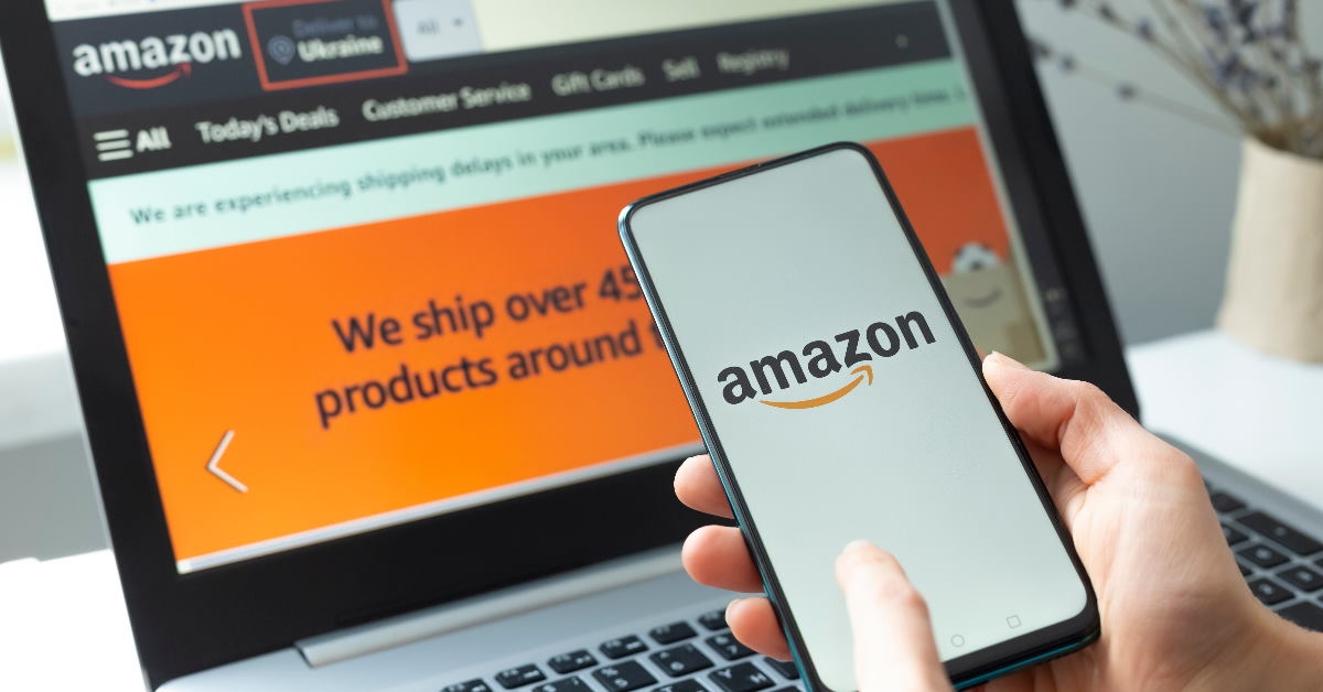 man using amazon online store app and website on laptop and smartphone