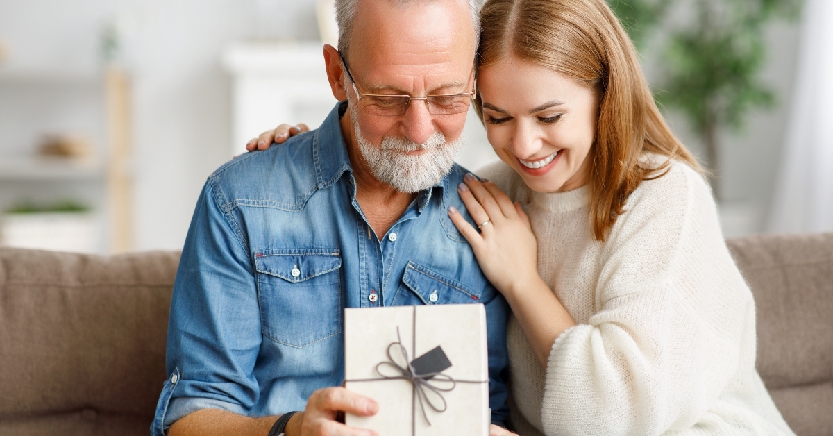 father and daughter examining gift