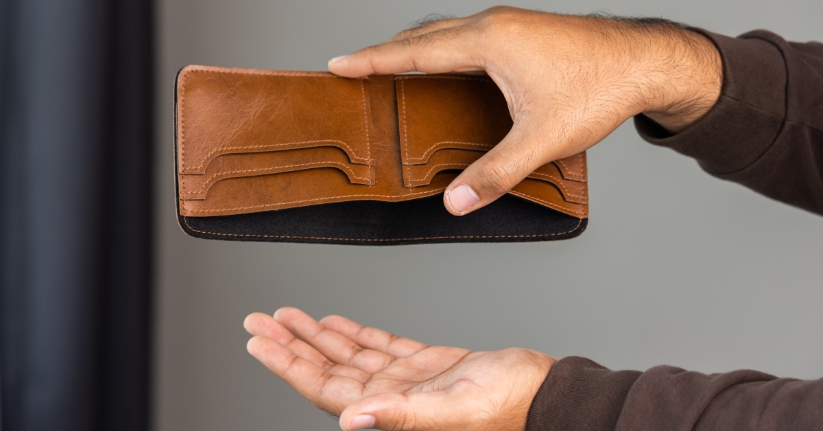 male hand opens an empty wallet