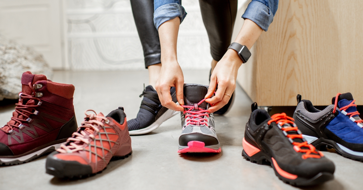 woman trying different trail shoes for mountain hiking