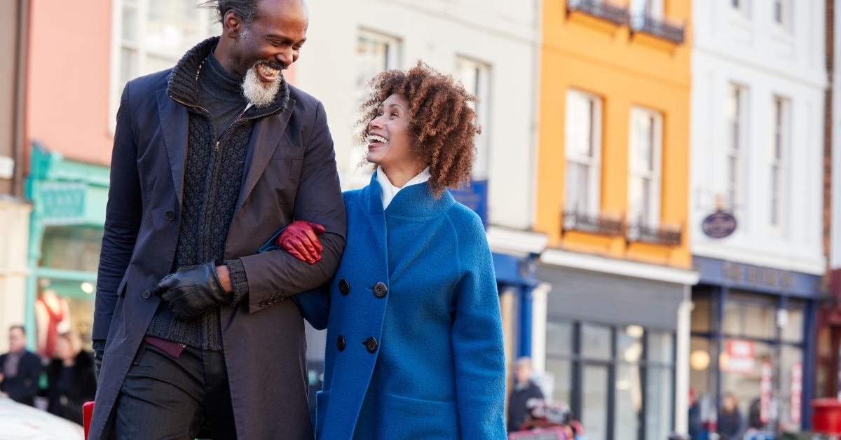 mature couple enjoying shopping in city together