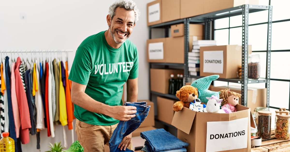middle age grey-haired man volunteer smiling