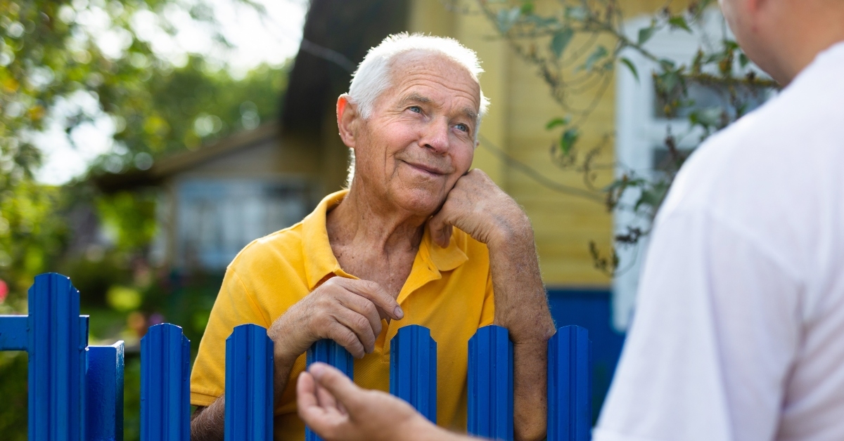 old man talking with his neighbor