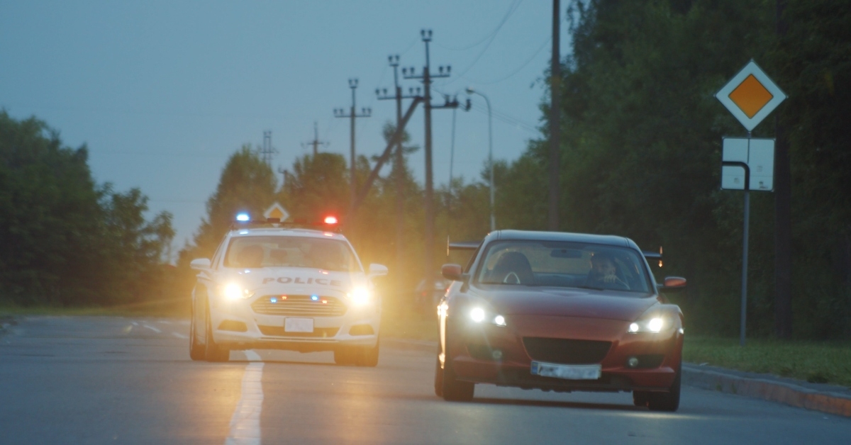 self-willed young man driving on modern sports car