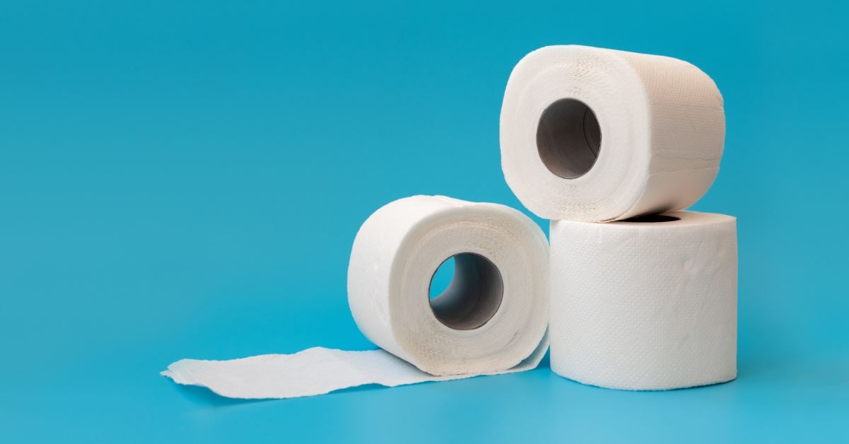tissue paper rolls rolling out on blue background