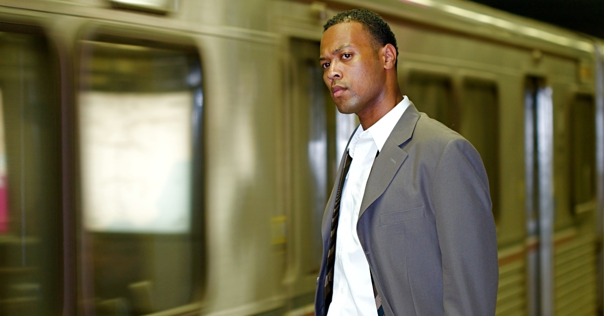 businessman awaits his commuter train