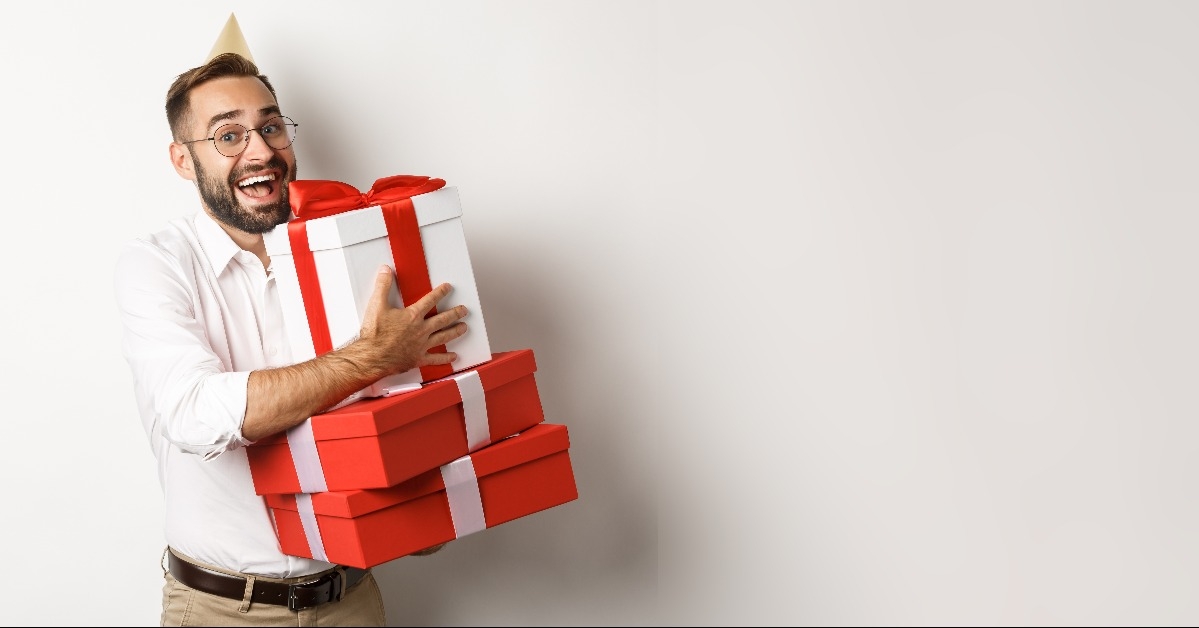 man having birthday party and receiving gifts