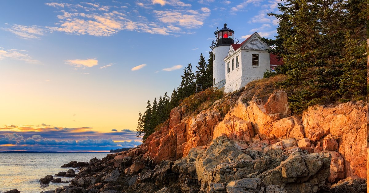 bass head light in front of water and rocks in acadia national park, maine