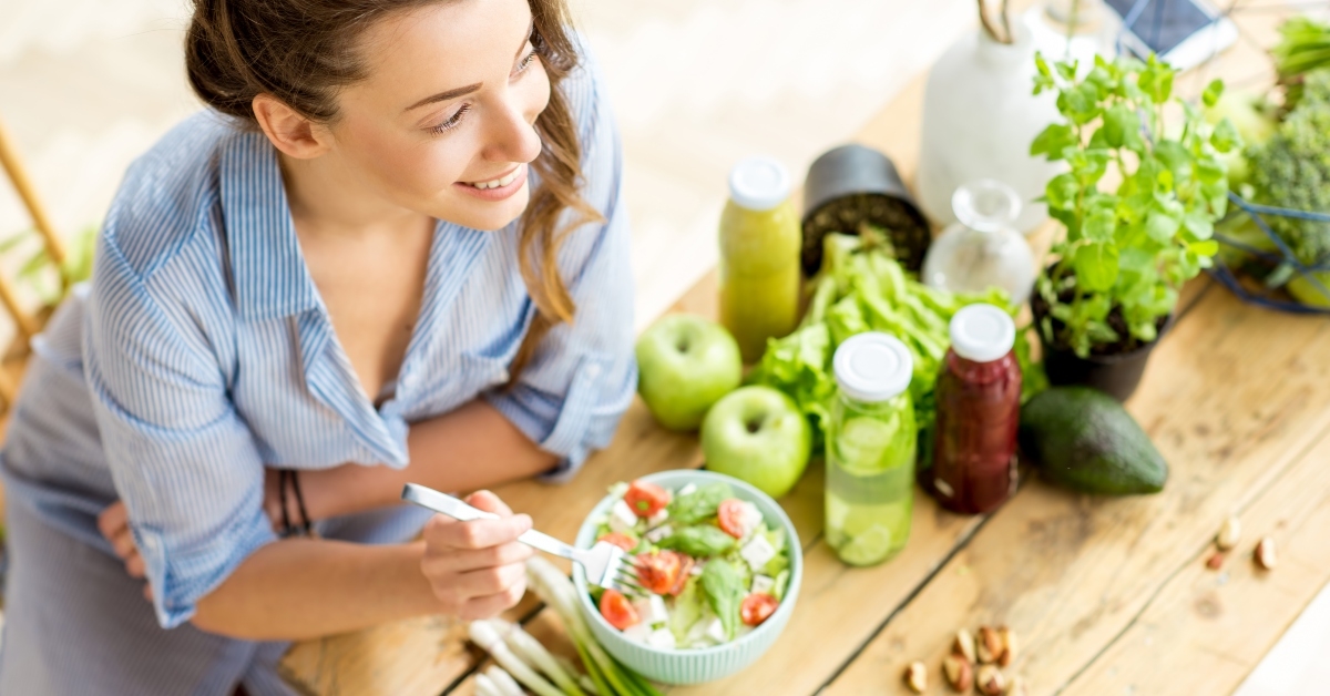 happy woman eating healthy salad