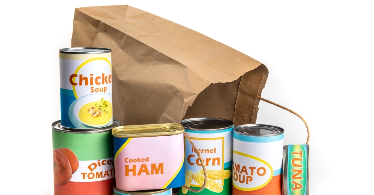 shopping bag with a variety of fake generic labelled food cans