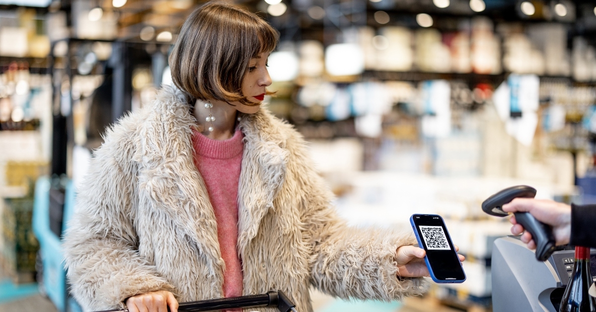 woman pays with a QR code