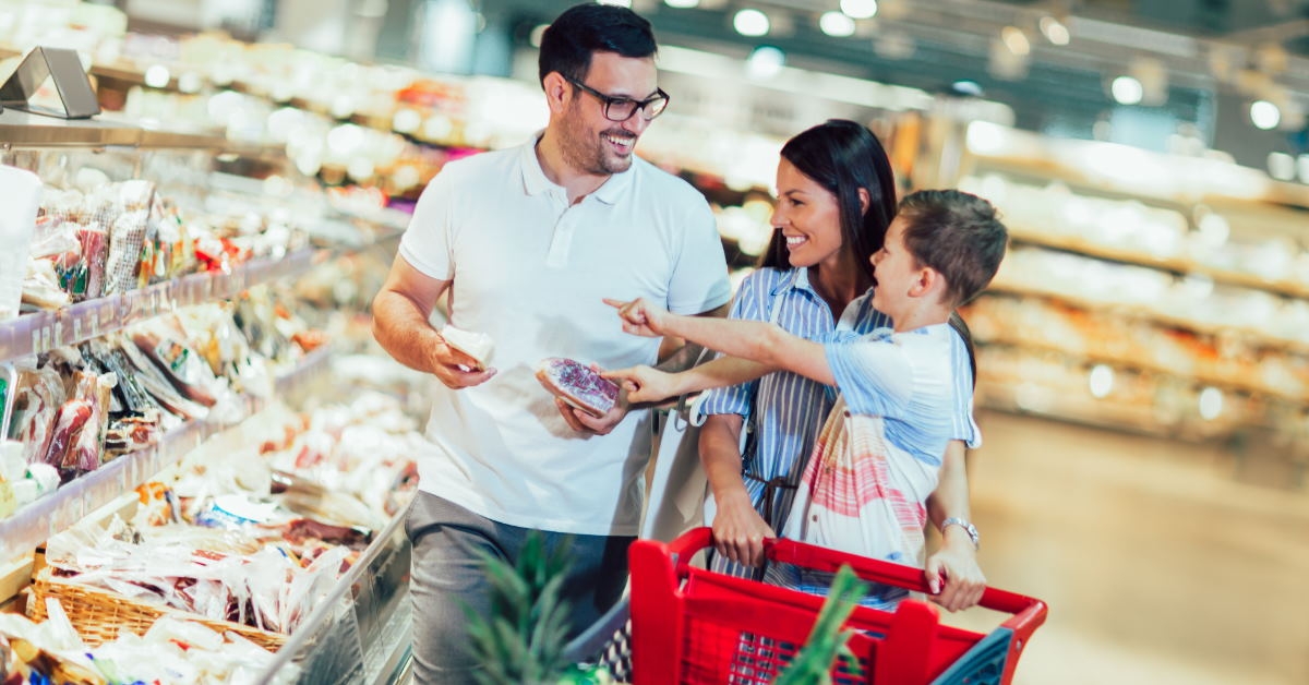 happy family doing grocery at supermarket 