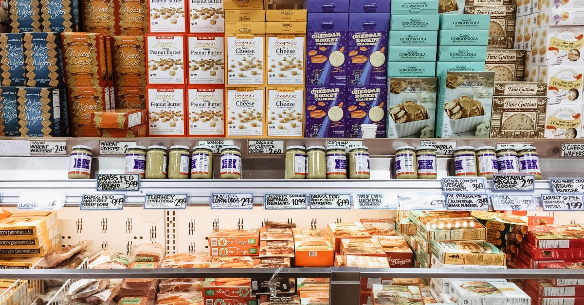 frozen food crackers and biscuits placed on shelves for sale in grocery store