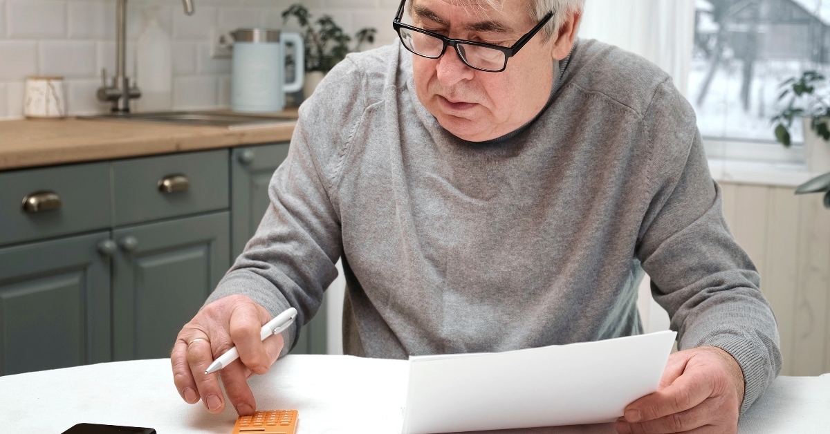 senior man calculating personal finance at home