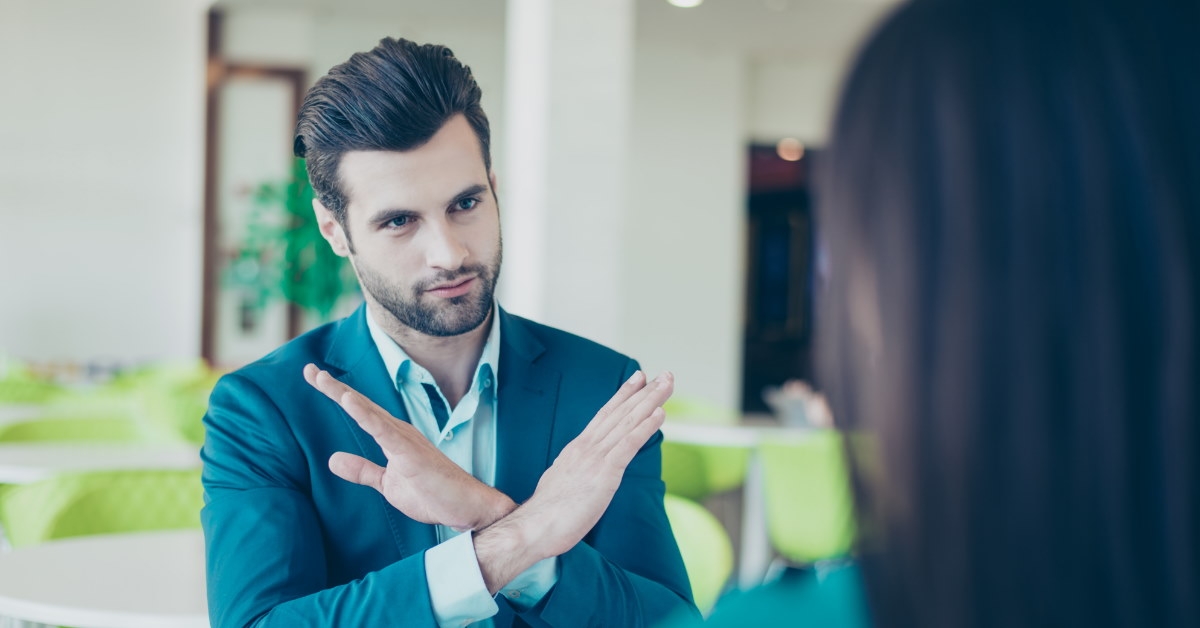 businessman saying no to businesswoman on table outdoor
