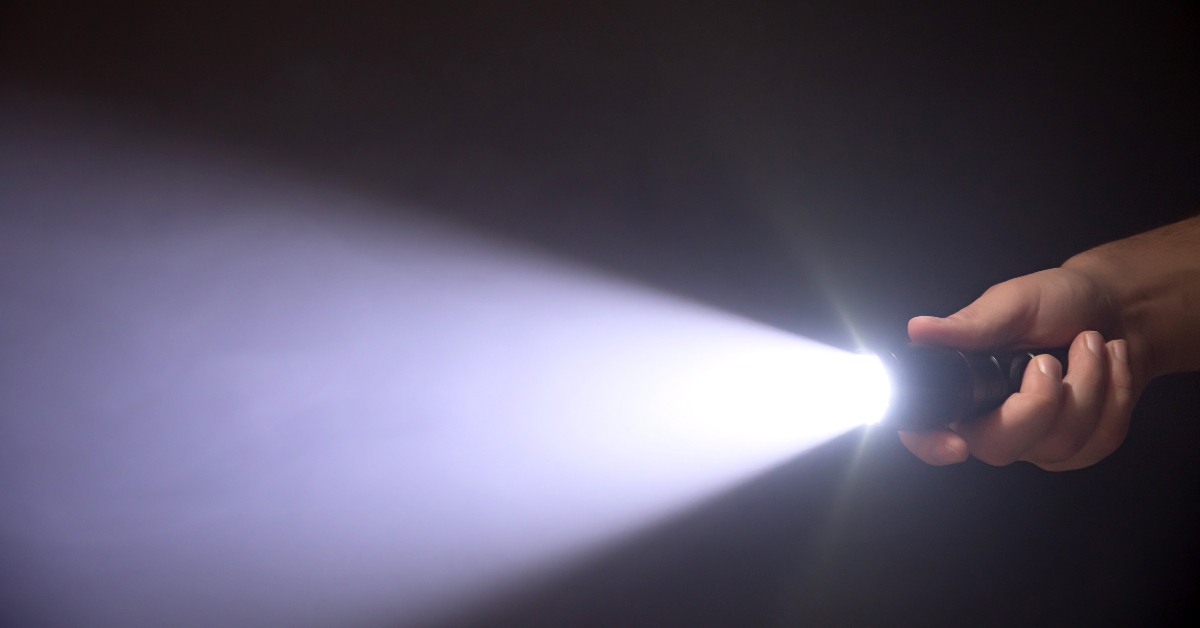 black flashlight a beam of light