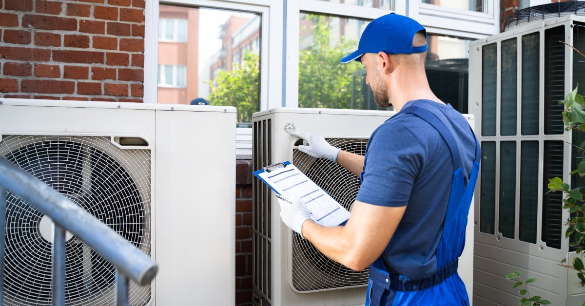 electrician checking air conditioning unit