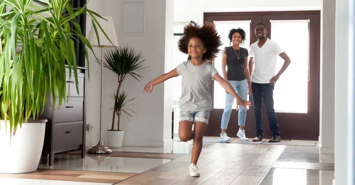 girl exploring big modern house after moving in