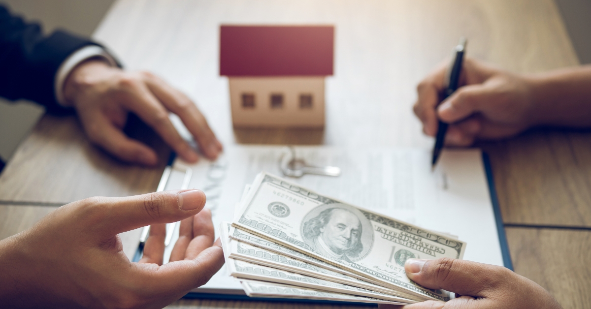 investors signing contract paper about buying a new home