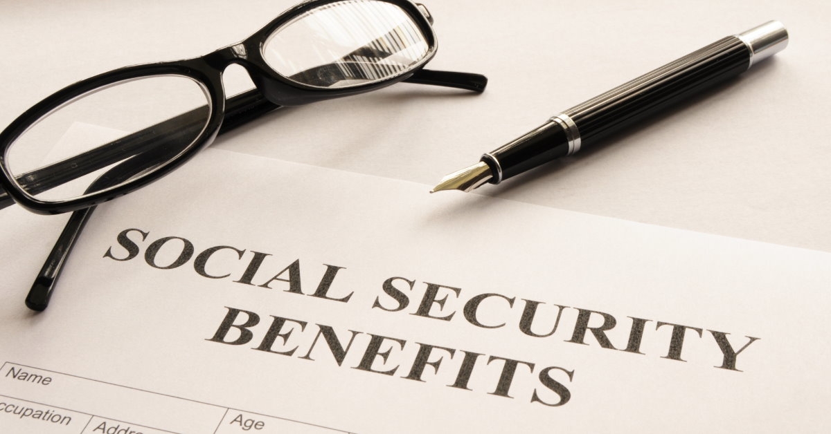 social security benefits form on table with glasses and pen