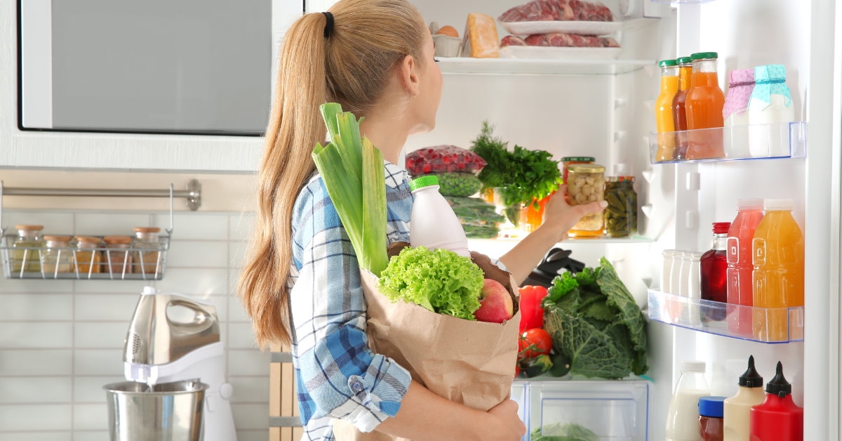 Woman putting away groceries