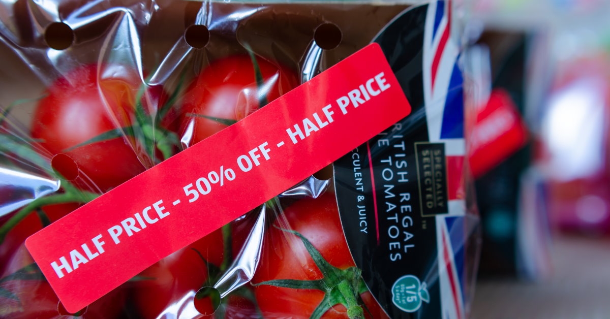 regal vine tomatoes packed with half price label at grocery store