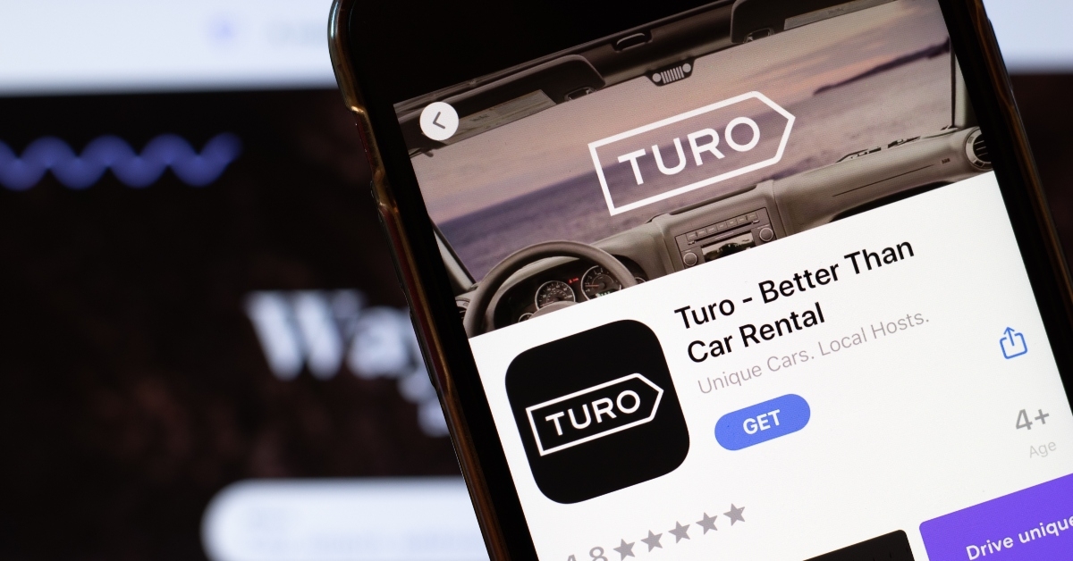 Turo app logo on phone screen