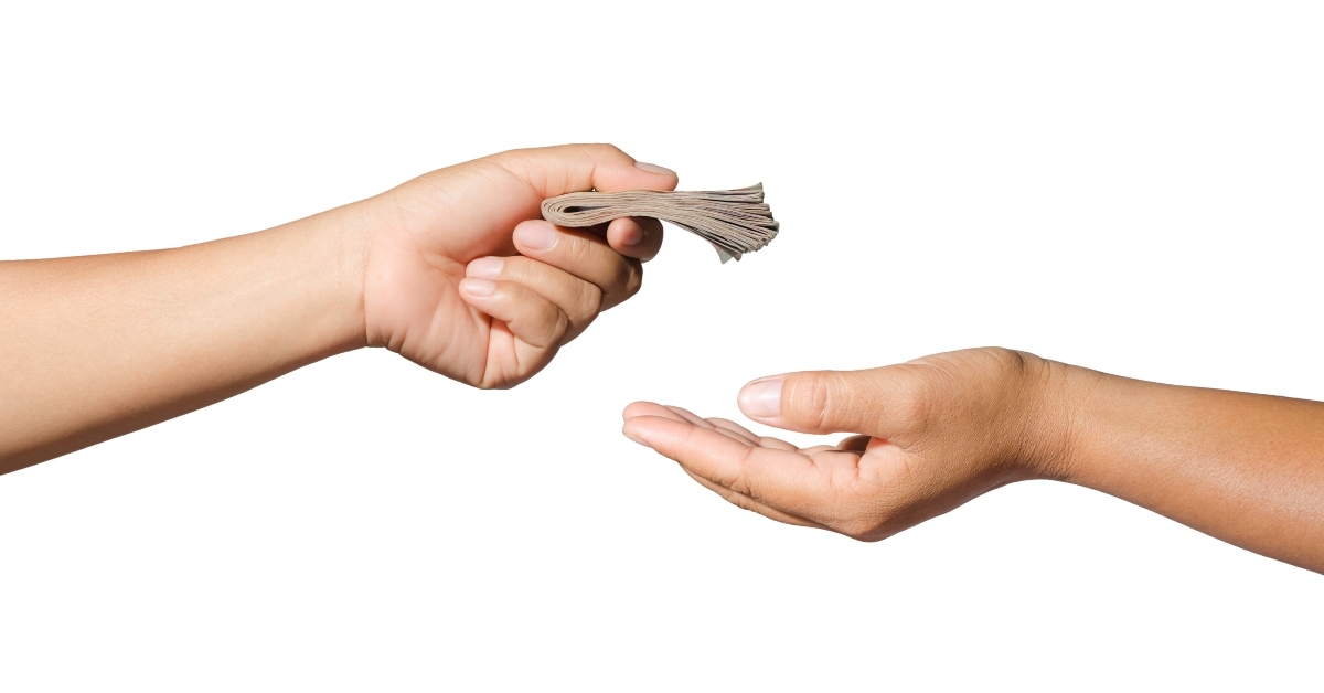 hand giving money cash